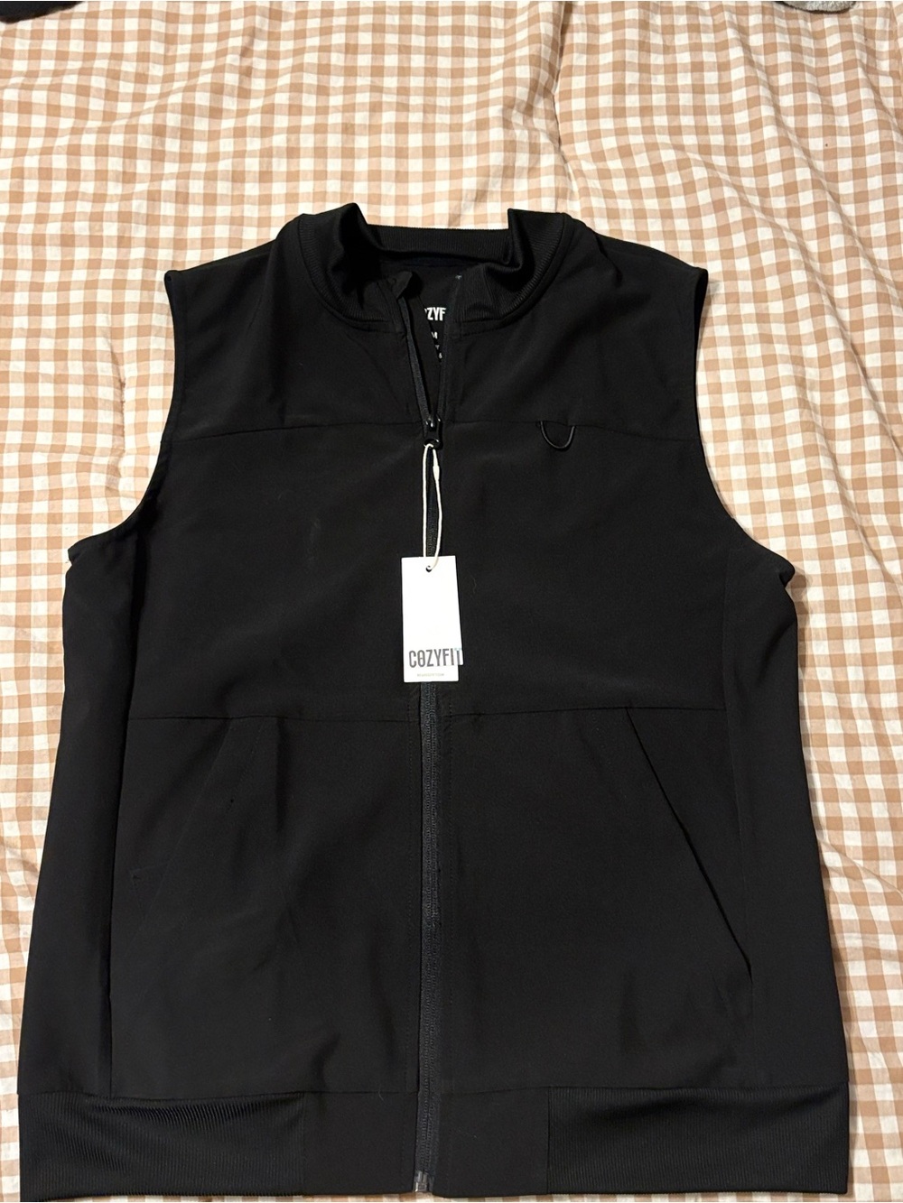 Women’s black zip up scrub vest with badge holder